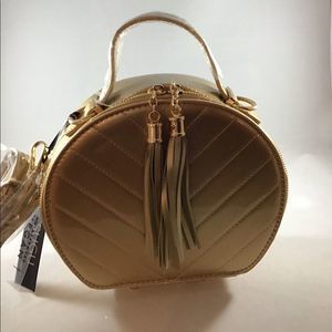 Sugu vegan gold round handbag.